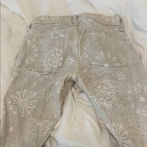 Bebe white and tan floral patterned pants